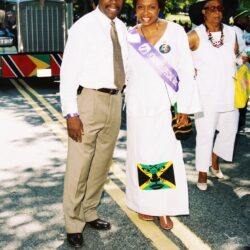 Two people posing at street parade.