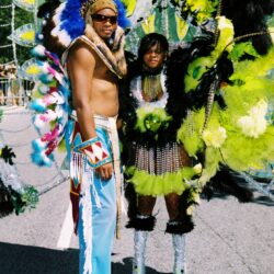Colorful carnival costumes with vibrant feathered designs.
