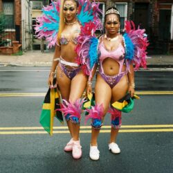 Two women in colorful carnival costumes.