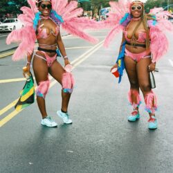 Two women in colorful carnival costumes.