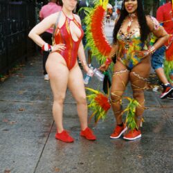 Two women in colorful carnival costumes.