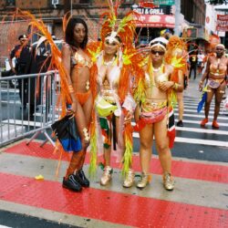 Carnival participants in vibrant, colorful costumes.