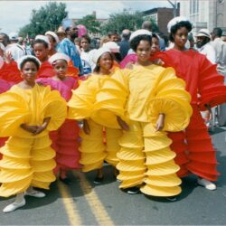 Group in colorful spiral parade costumes
