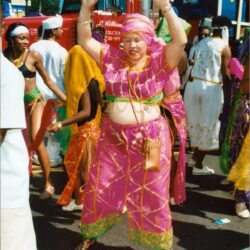 Dancer in pink costume at street parade