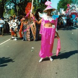 Parade performer in bright pink costume