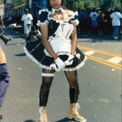Performer in black-and-white costume with top hat