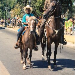 Two riders on horses at outdoor parade