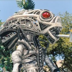 Mechanical serpent sculpture with red eye