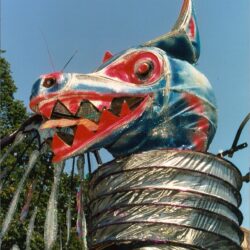 Colorful metallic dragon fountain spouting water