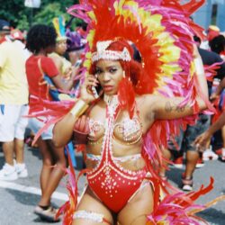 Carnival dancer in red feathered costume
