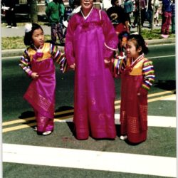Woman and girls wearing pink hanbok at parade